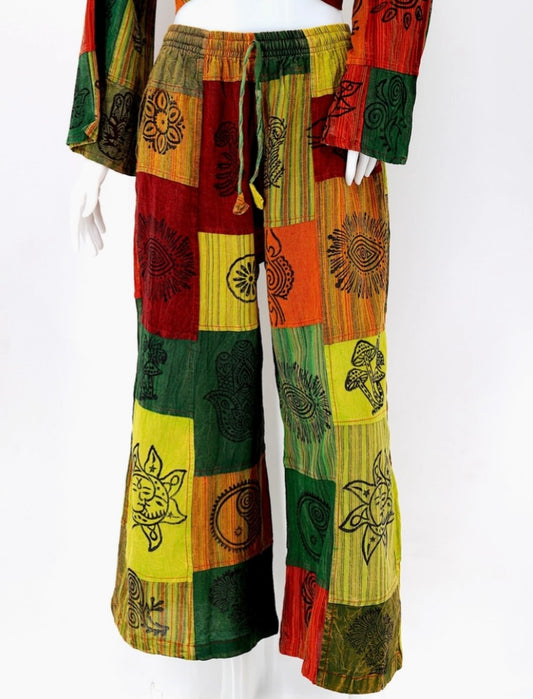 patchwork palazzo pants with sun hamsa design in green front