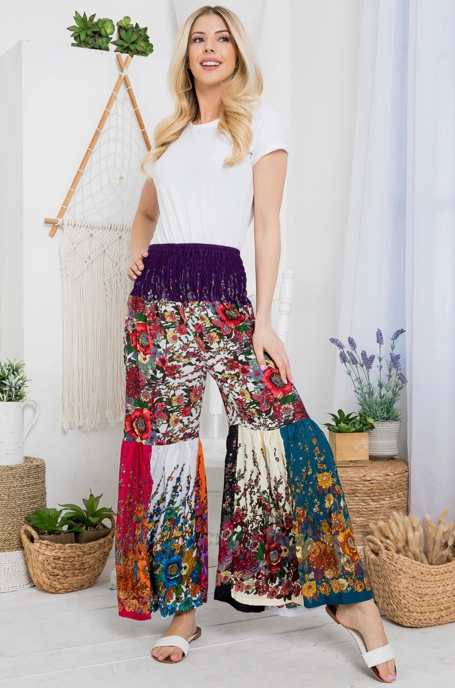 wide leg patchwork boho pants with flowers front paired with white top