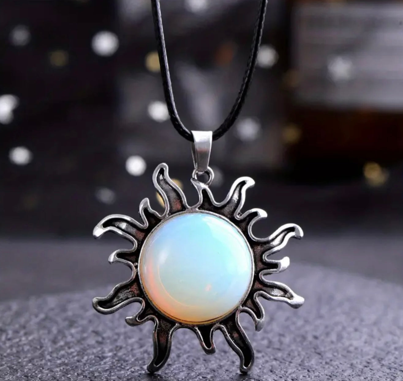 opal sun necklace on black cord