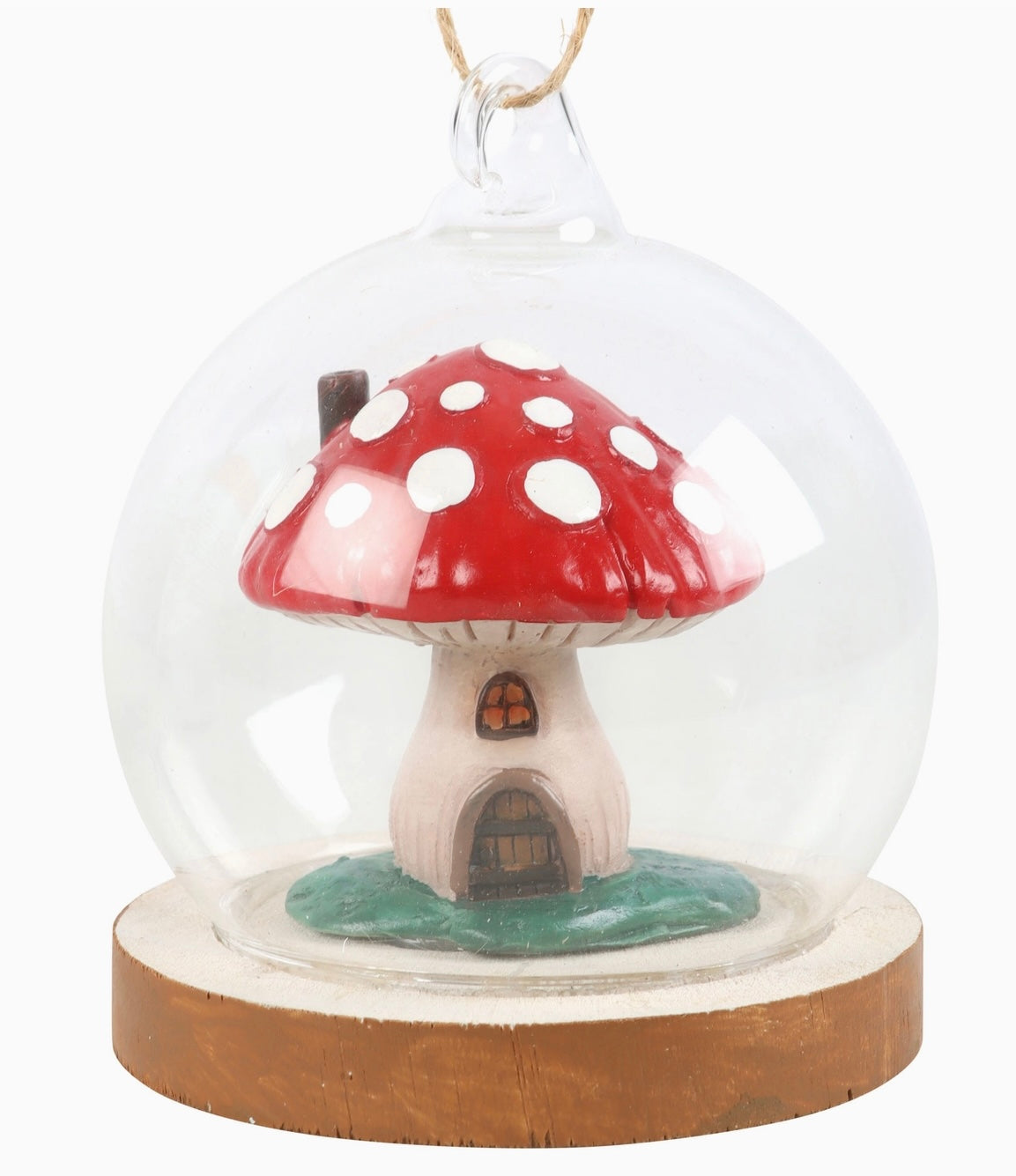 mushroom house ornament inside of glass dome