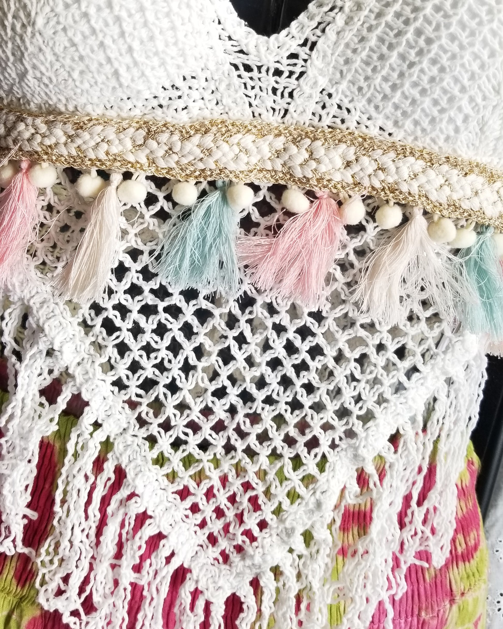 close up white crochet halter top with pink blue tassels the boho hippie hut