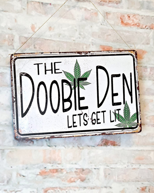 weed wall décor metal sign that says the doobie den lets get lit close up