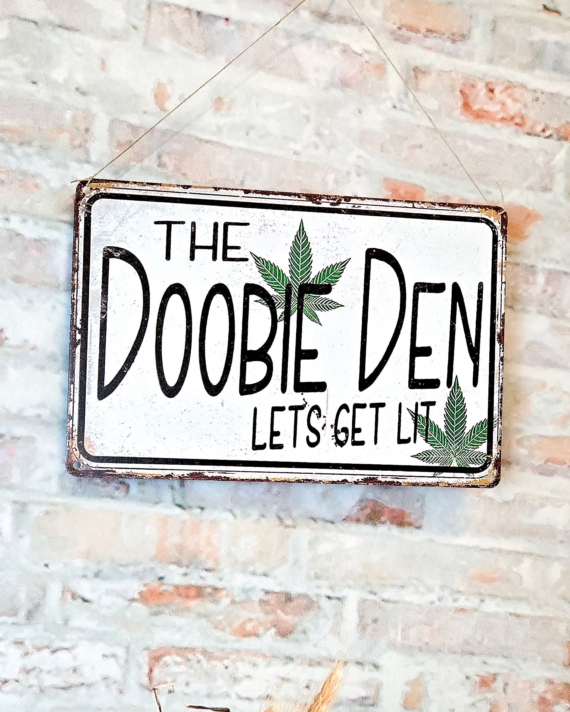 hippie décor weed metal sign that says the doobie den lets get lit