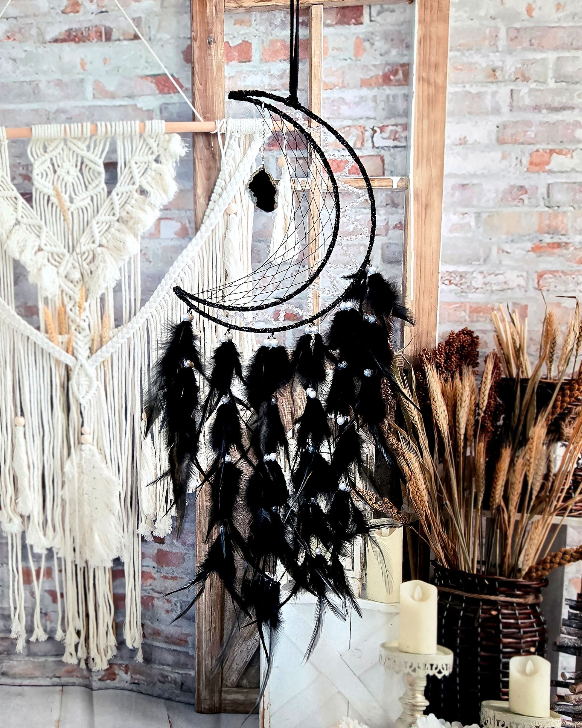 crescent moon dream catcher with black feathers and hanging geode