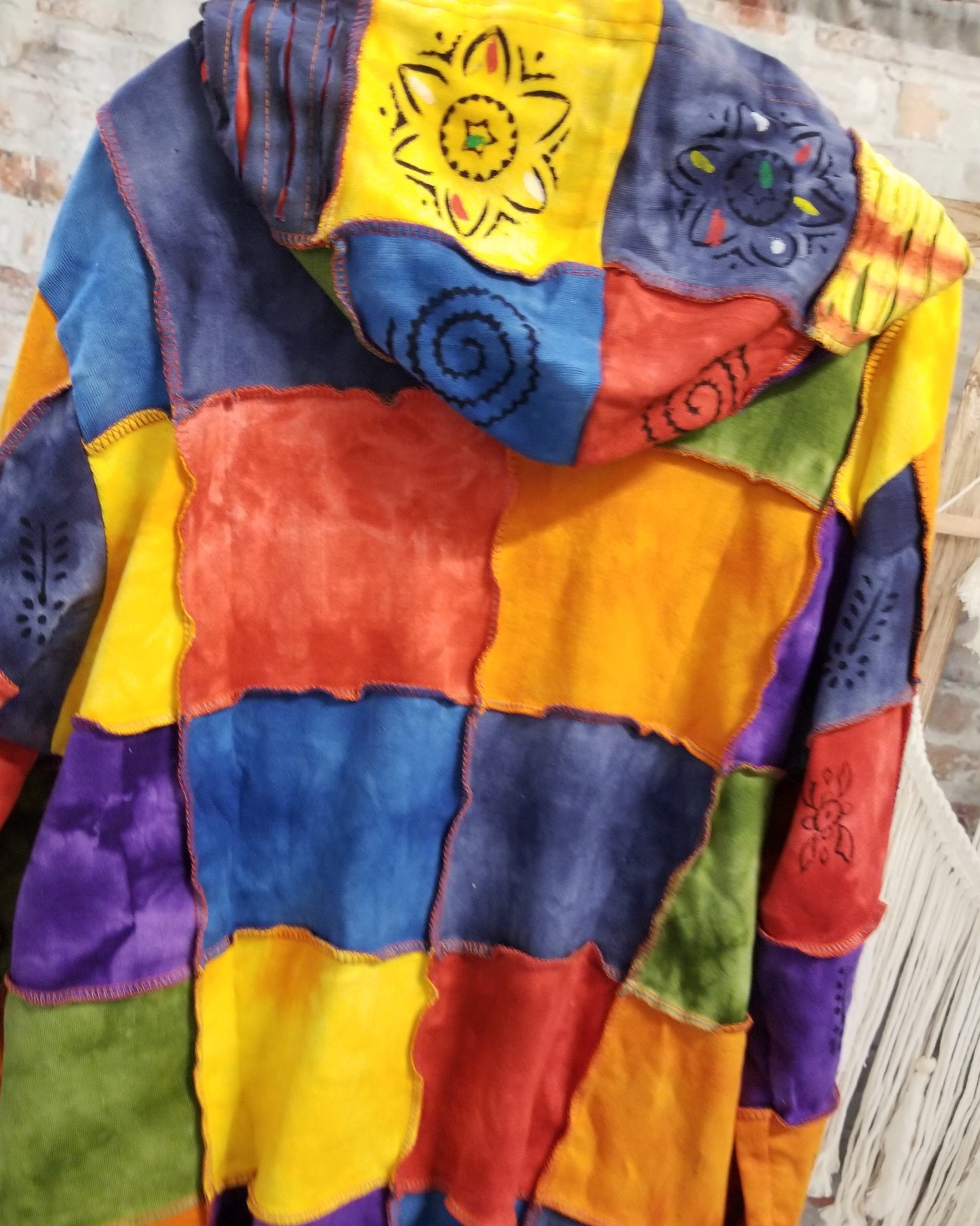 razor cut patchwork jacket in multi color with sun and om designs back