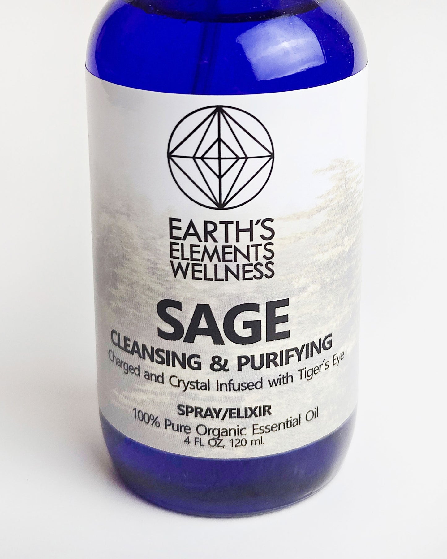 sage essential oil spray with tigers eye crystals close up