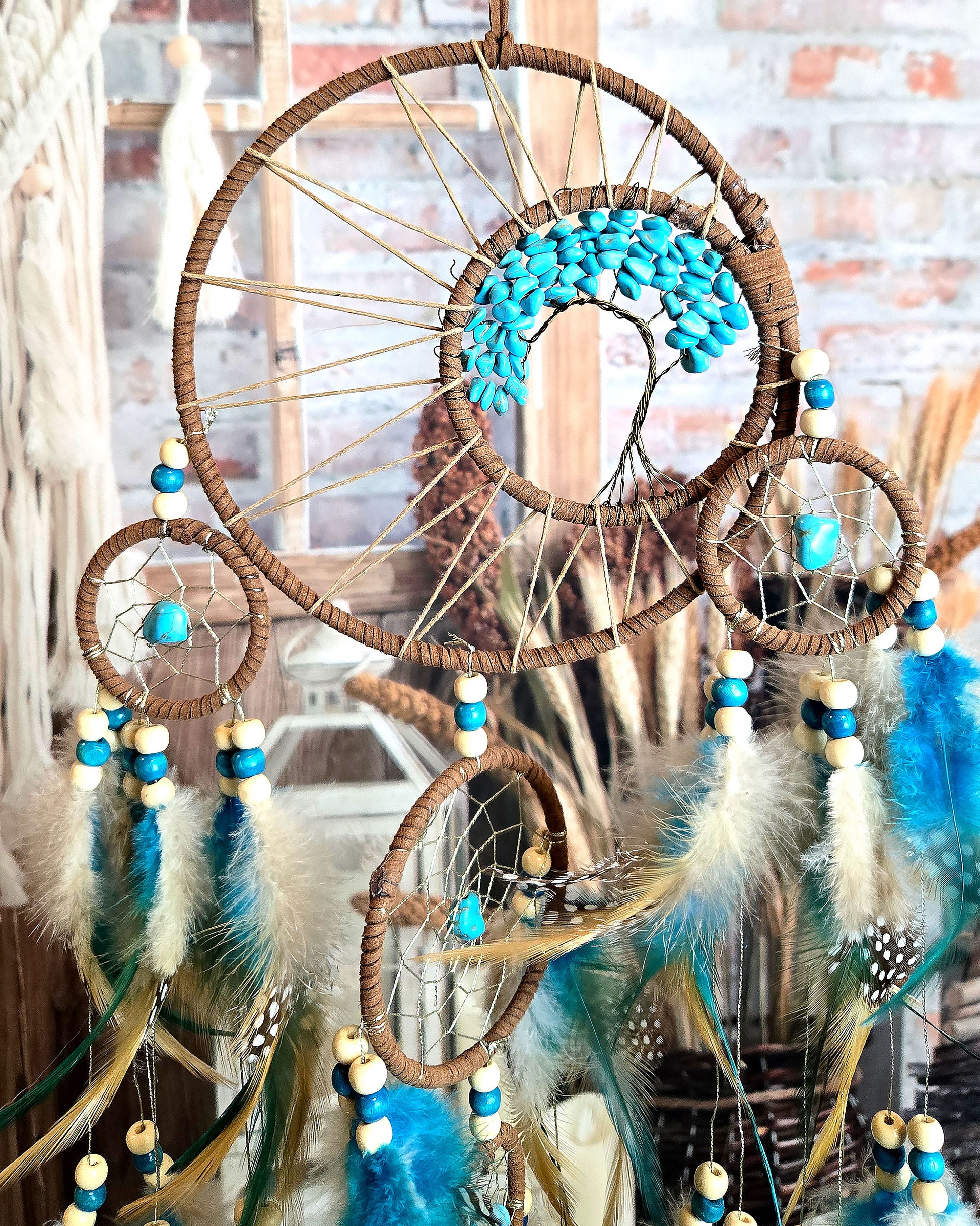 teal and brown tree of life dream catcher with feathers