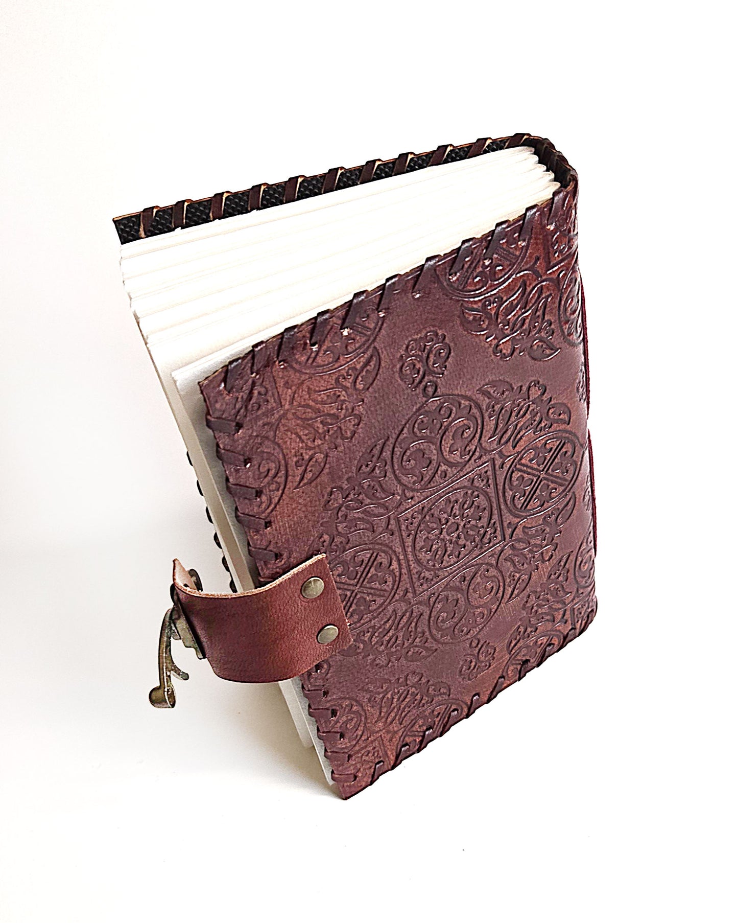 leather writing journal with embossed the moon tarot card design antique buckle closure and leather stitched edges top back