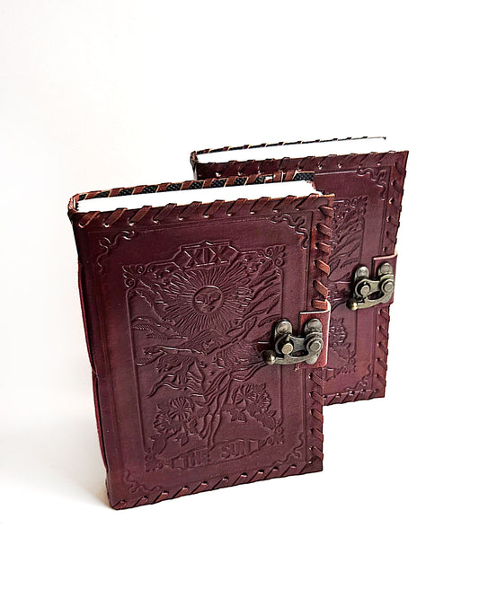 leather journals with embossed the sun tarot card design antique buckle closure and leather stitched edges