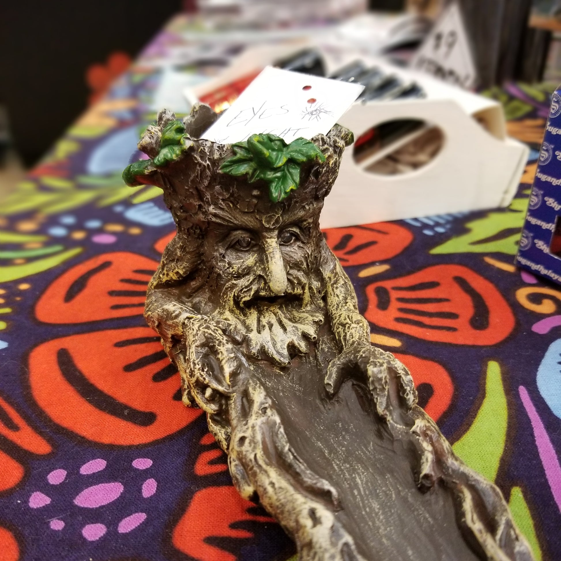 close up of tree man incense holder for sticks or cones