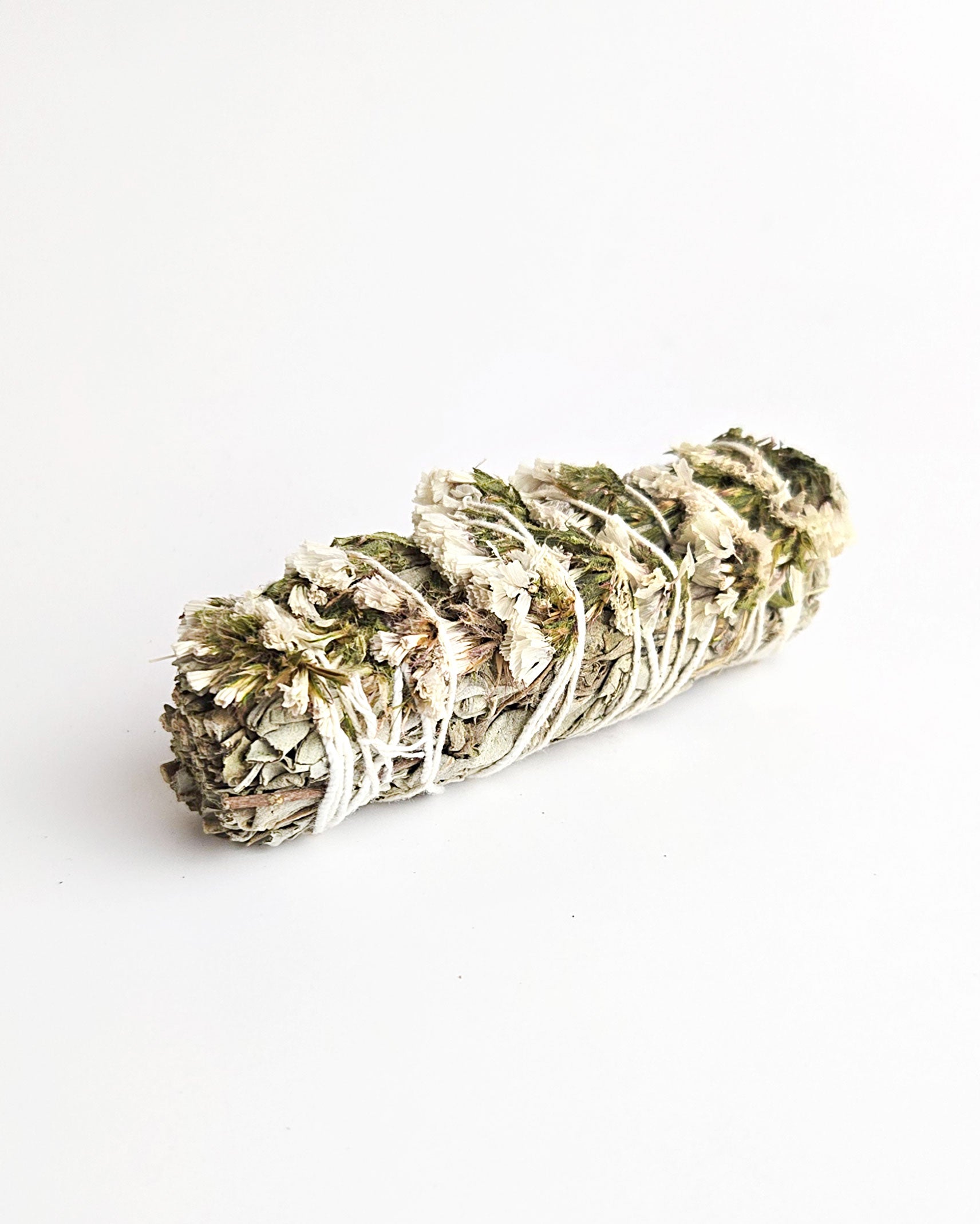 sage stick with white sinuata flowers for smudging and cleansing