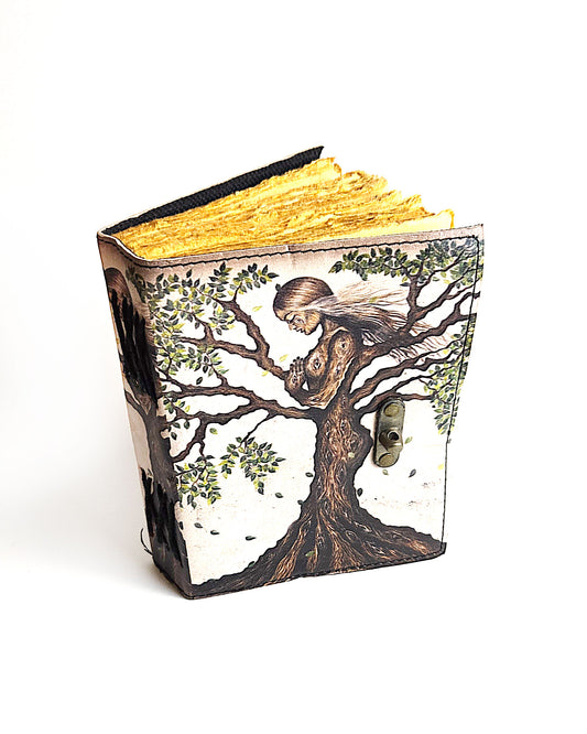 leather journal with mother nature tree of life design and antique buckle closure and deckle edge vintage look paper top front